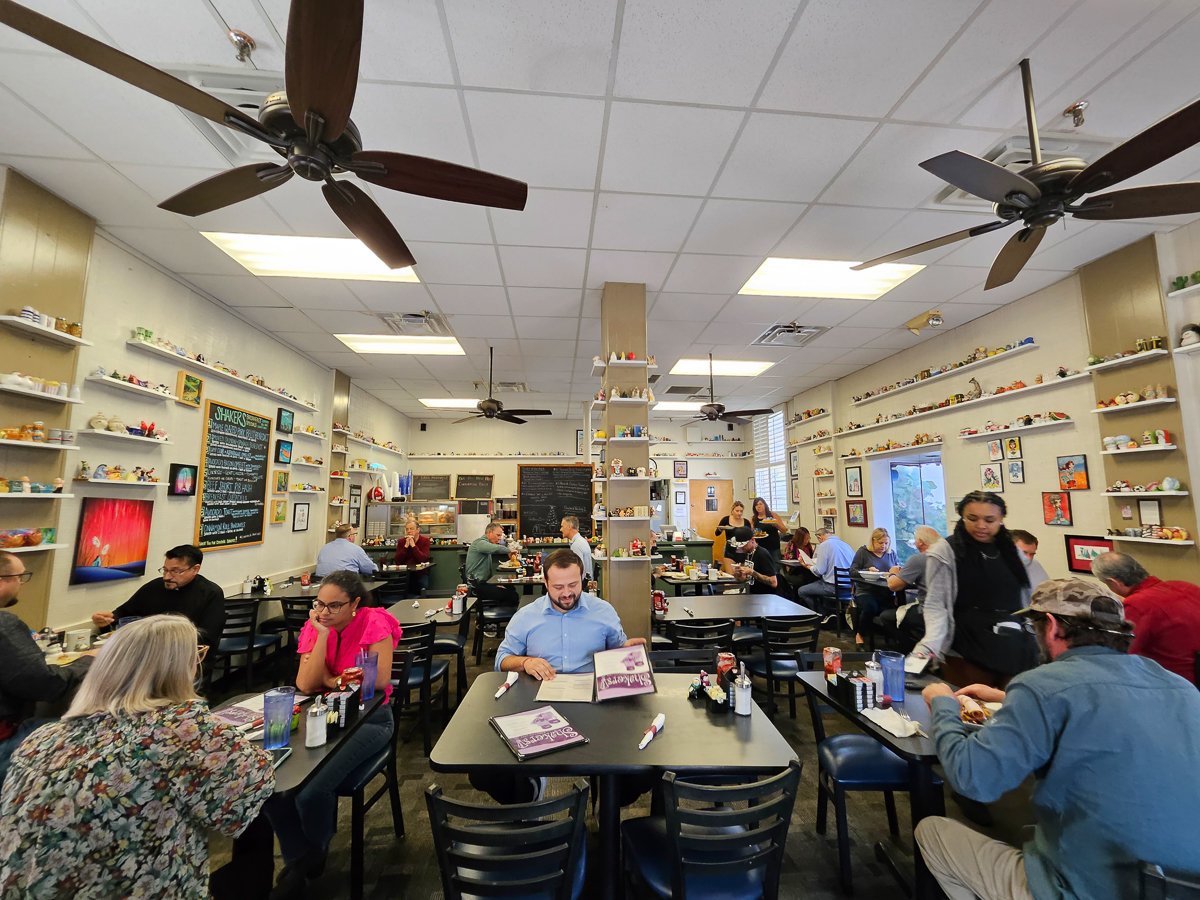 wide view of restaurant with shakers lining the walls on small shelves
